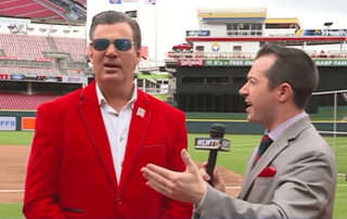 Brandon Saho standing next to Reds Owner Bob Castellini